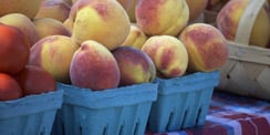 peaches for sale at a farmers market