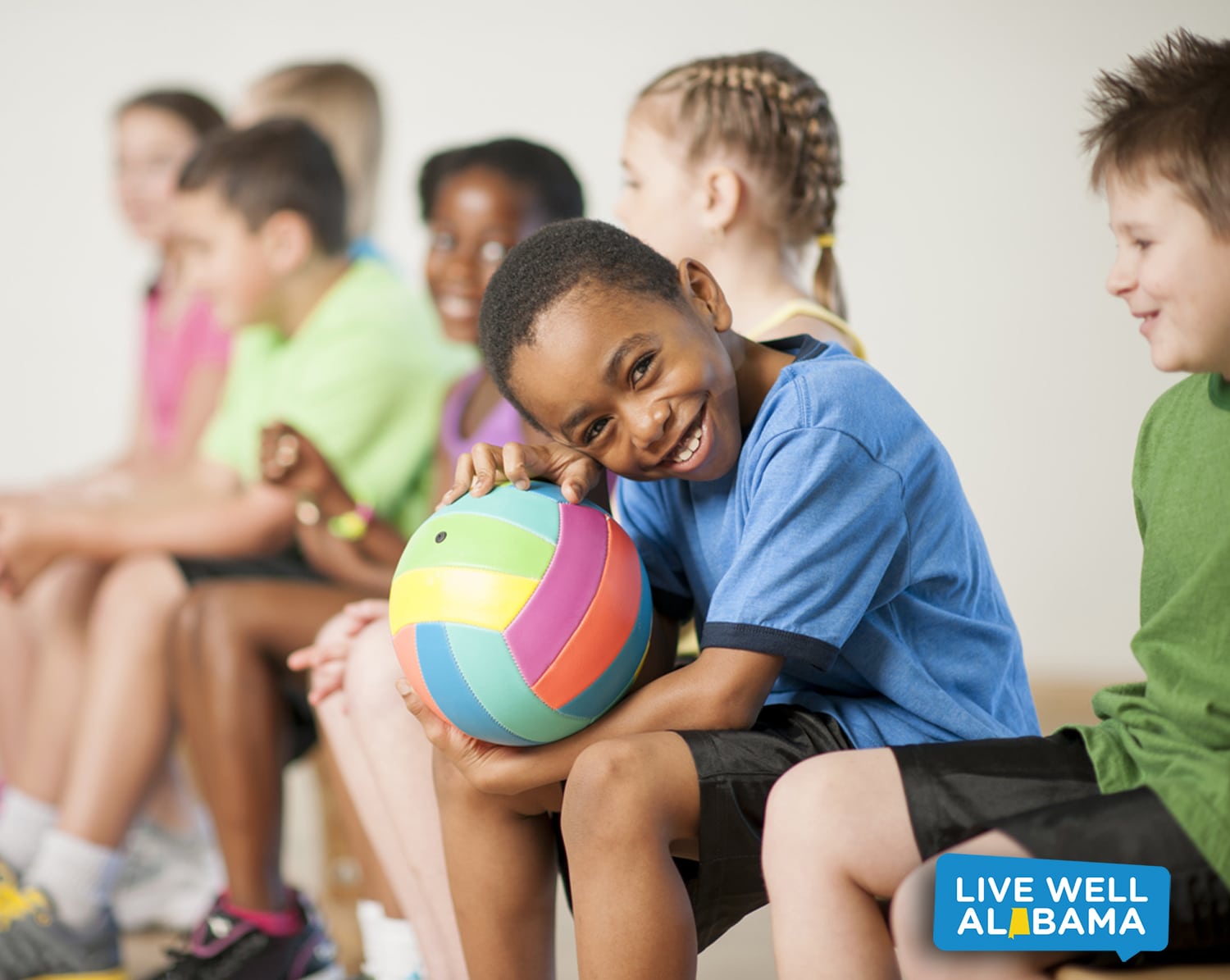 Quest for Healthy Schools boy holding ball in gym class