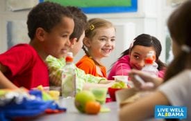 Body Quest group of children having packed lunches