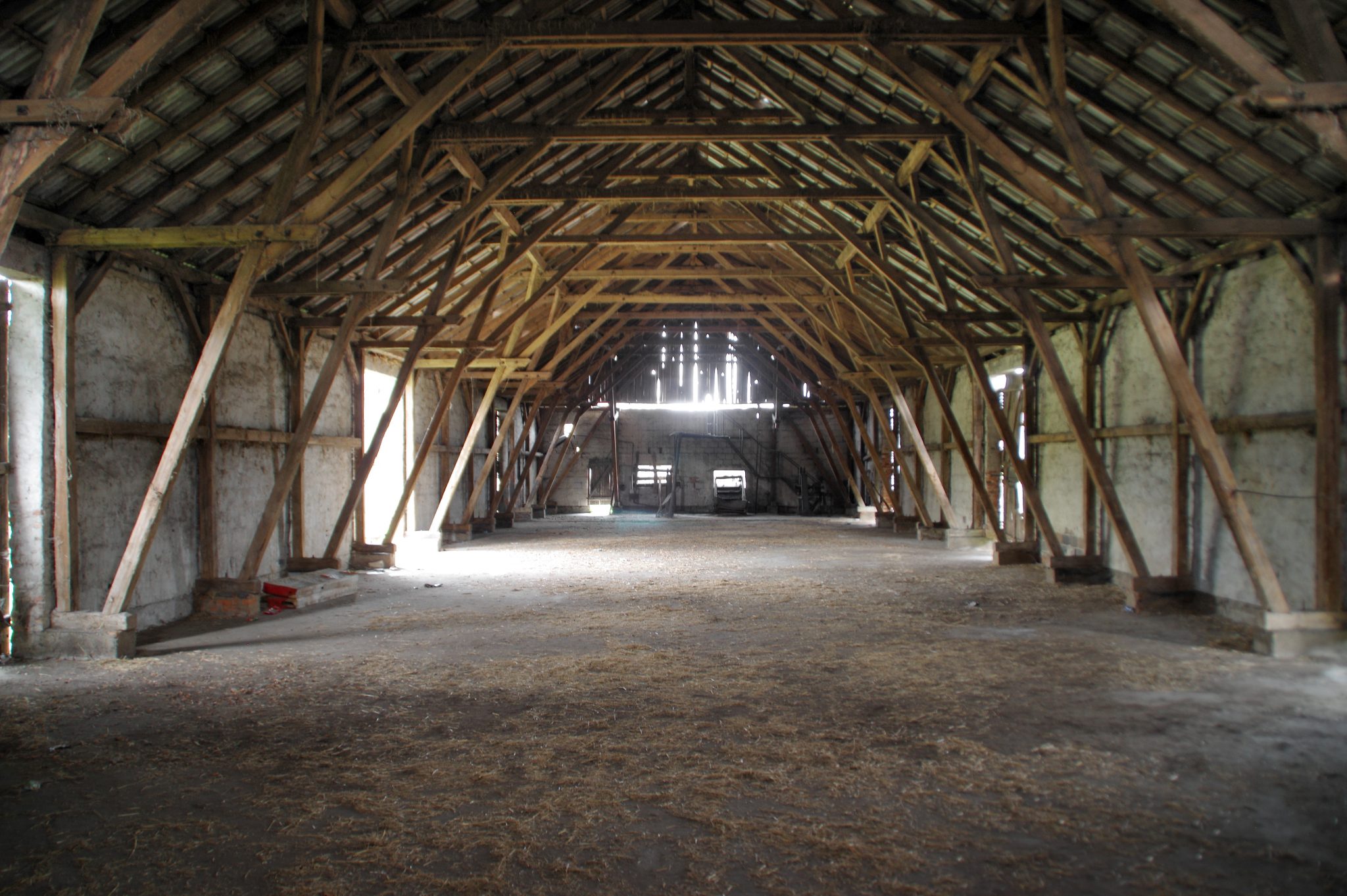 Empty rural barn with wooden supports
