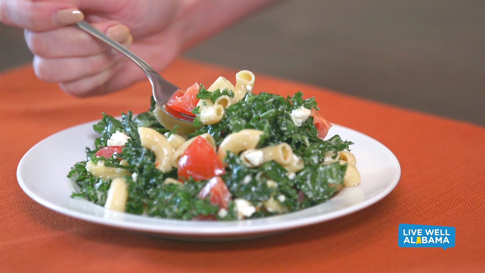 Live Well Alabama recipe, Pasta and Kale Salad. Includes kale, pasta, tomatoes and light dressing.