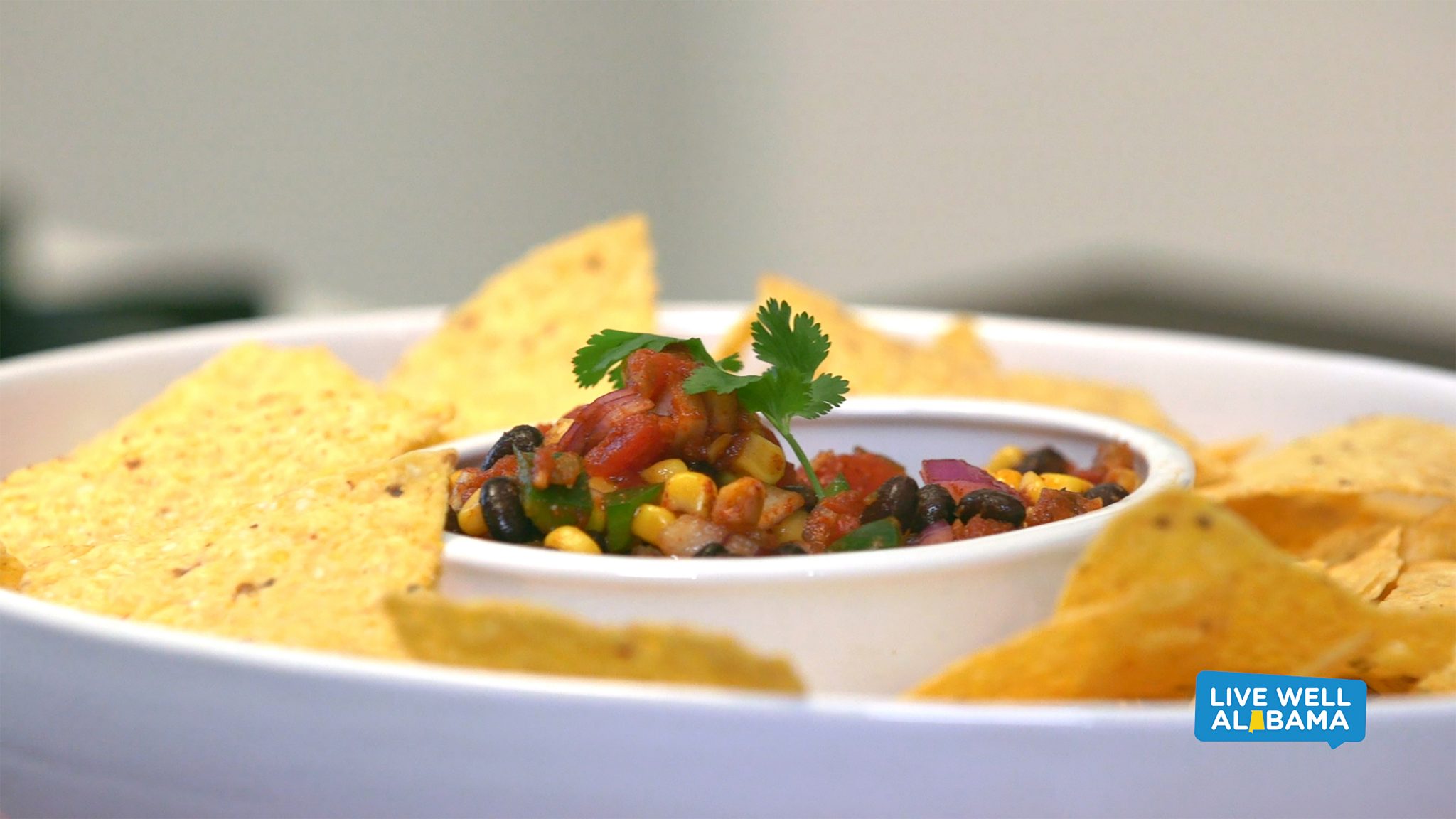 Live Well Alabama recipe, Tasty Taco Dip. Served with corn chips.