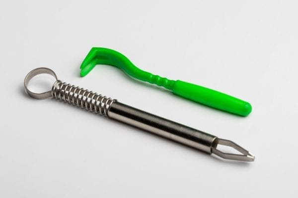 Figure 8. Tick tool and tweezers to properly remove ticks
