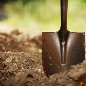 Soil with shovel. Close-up, shallow DOF. shutterstock.com/logoboom