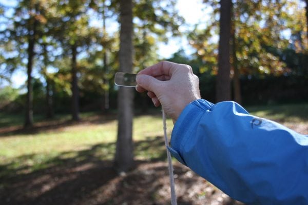 Using a wedge prism for a forest inventory (Photo credit: Becky Barlow)