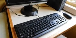Image of keyboard, partial monitor and mouse