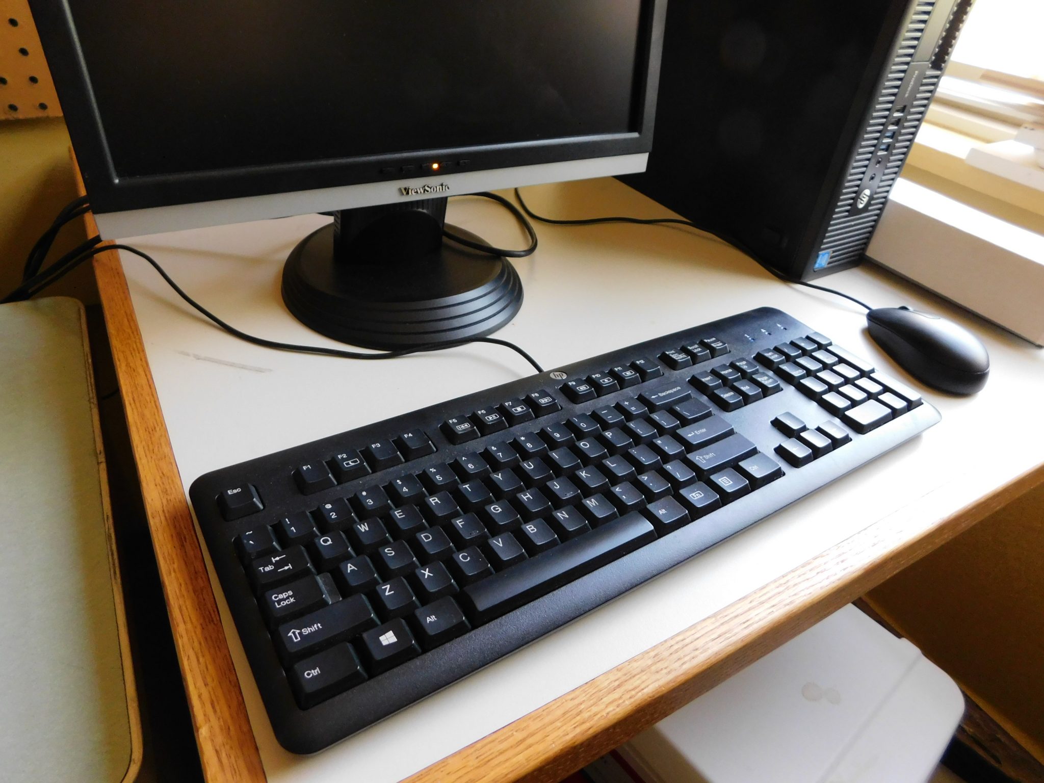 Image of keyboard, partial monitor and mouse