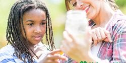 Alabama 4-H volunteer outdoors with 4-H member monitoring water quality