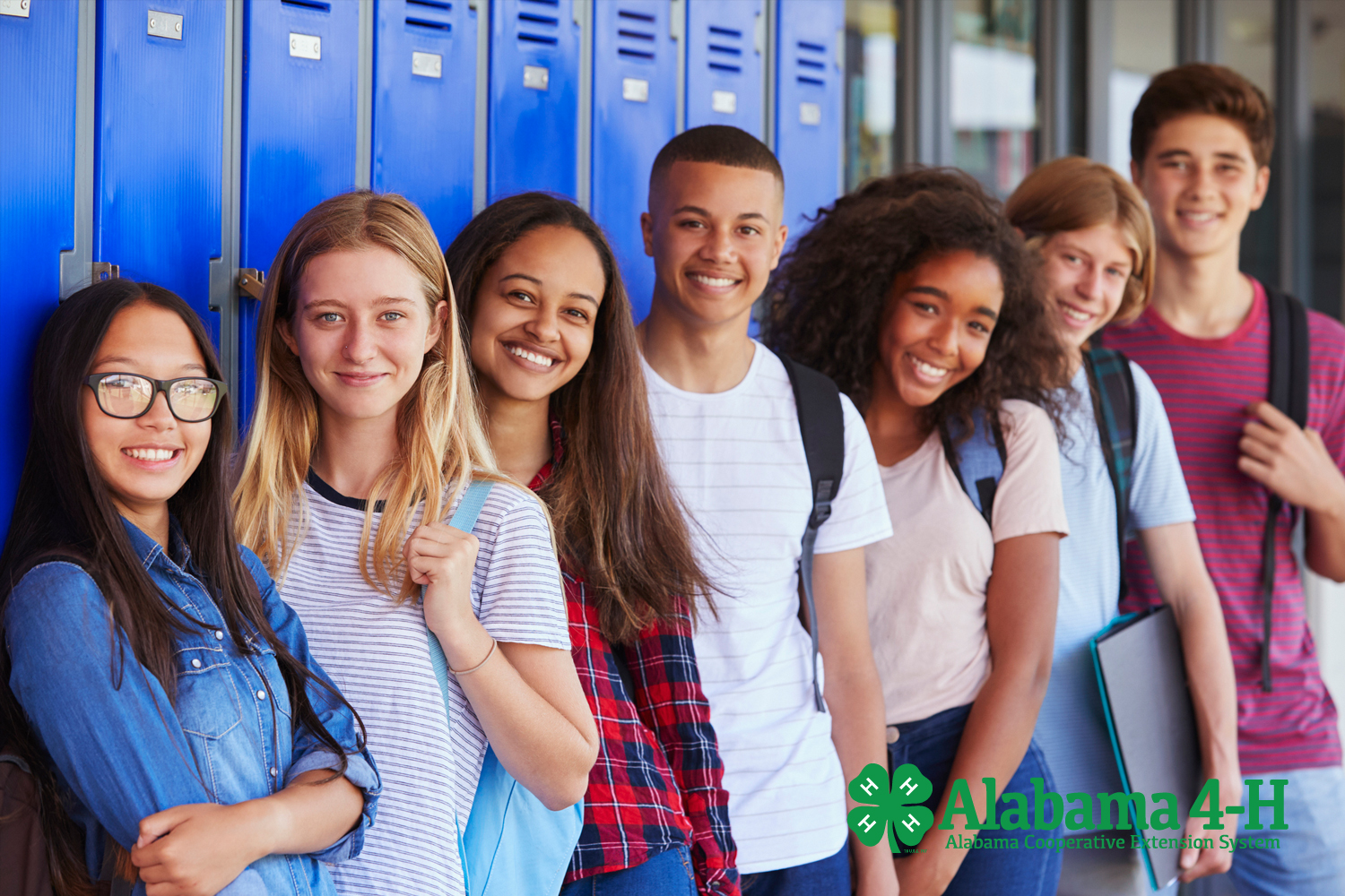 Alabama 4-H Club Officers next to lockers in hallway