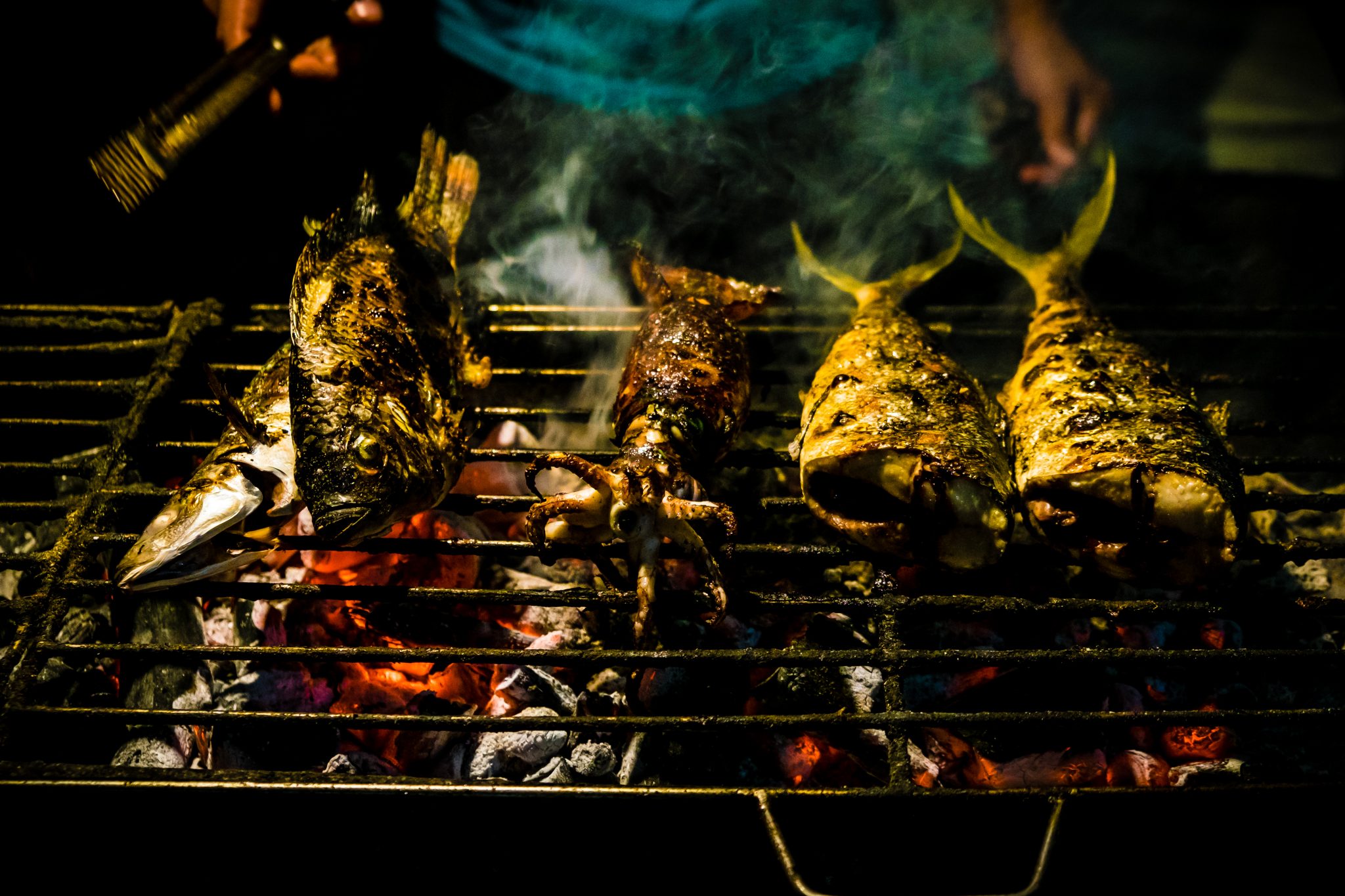 Close-Up Of Seafood On Barbecue Grill At Night