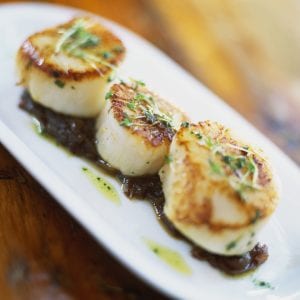 Grilled scallops on bed of onion confit