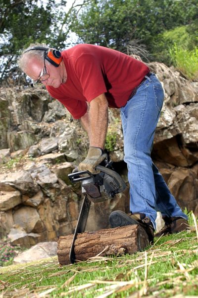 Man using chainsaw
