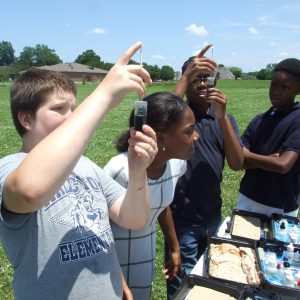 A group of students participating in water chemistry observations.