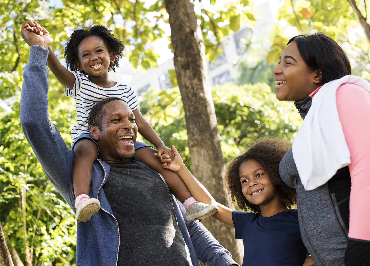 Eating Smart Being Active; African American family walking in the park