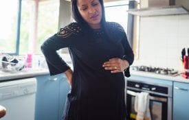 Alabama EFNEP; Woman having back pain because of pregnancy