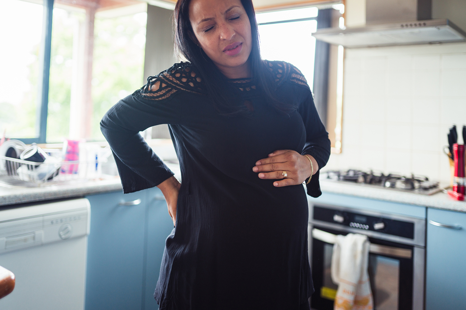 Alabama EFNEP; Woman having back pain because of pregnancy