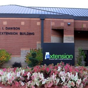 Exterior of the Dawson building with Extension sign in front