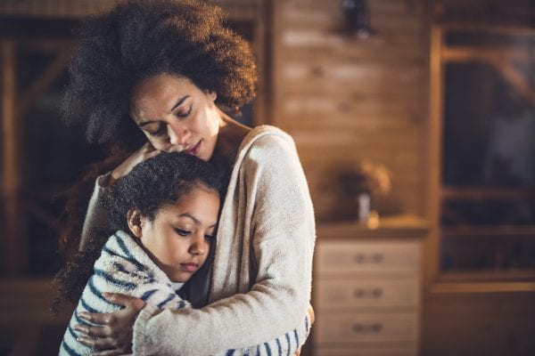 mother consoling her daughter.