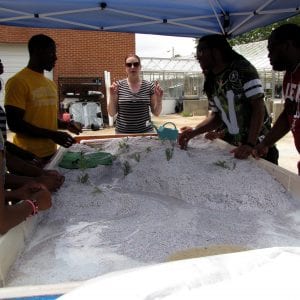Participants work with a mentor adjusting topography in a model for the water cycle