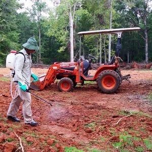 applying pesticide to an open lot