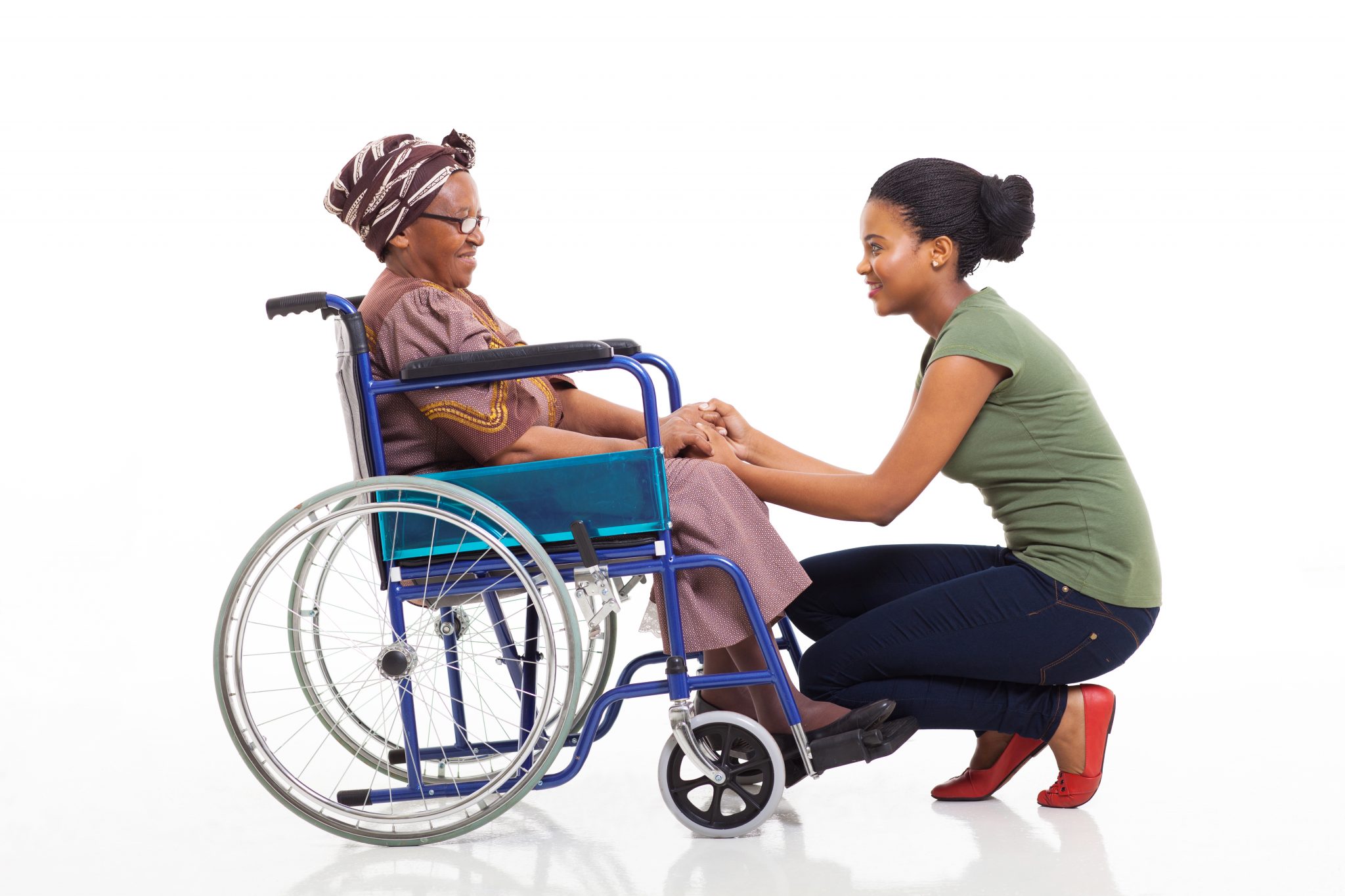 african daughter talking to disabled senior mother