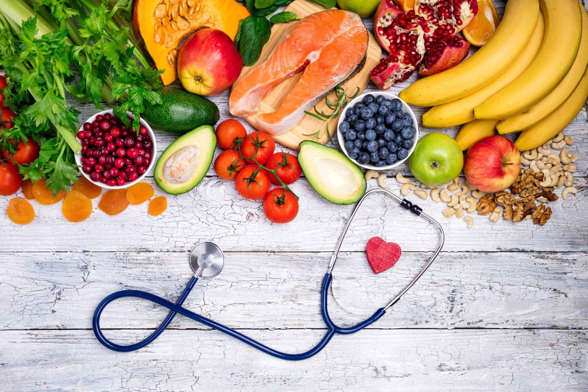 Healthy food for heart. Fresh fish, fruits, vegetables, berries and nuts. Healthy food, diet and healthy body concept.