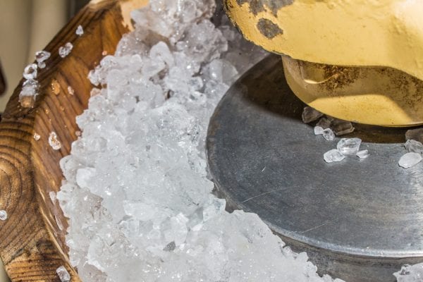 A hand crank ice cream freezer