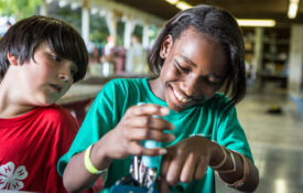kids working together on electronics and robitics