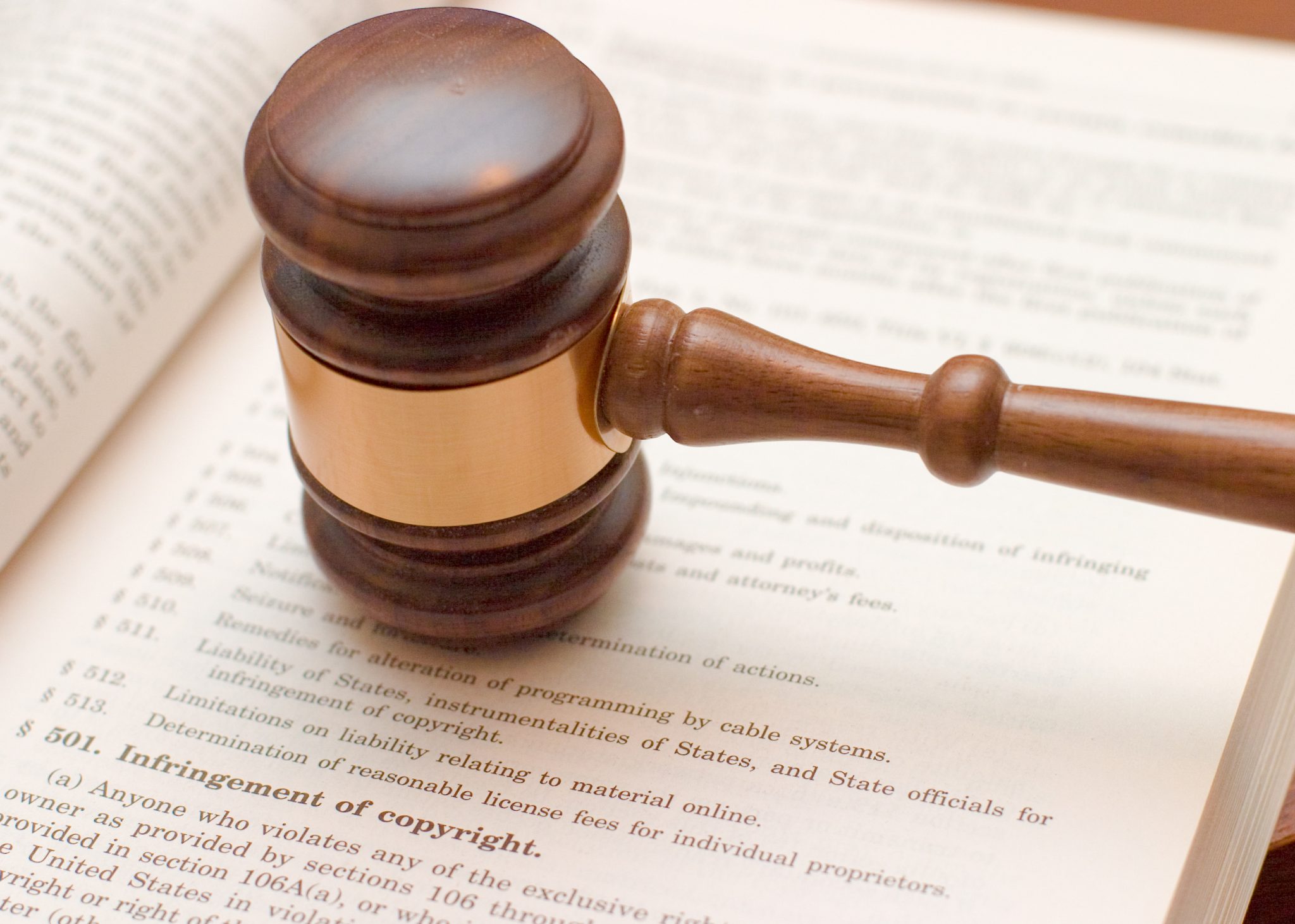 Copyright law concept: gavel over 17 U.S.C. 501 (copyright infringement)