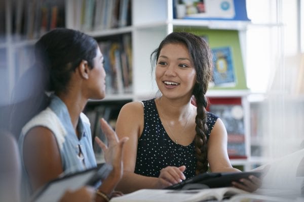 Two female students talking