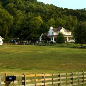 Country Farm with White Barn and White House or Home