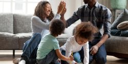 African American family playing indoors