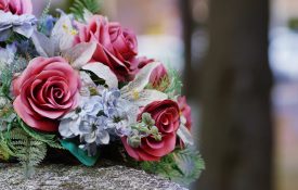 Silk flowers on a gravestone