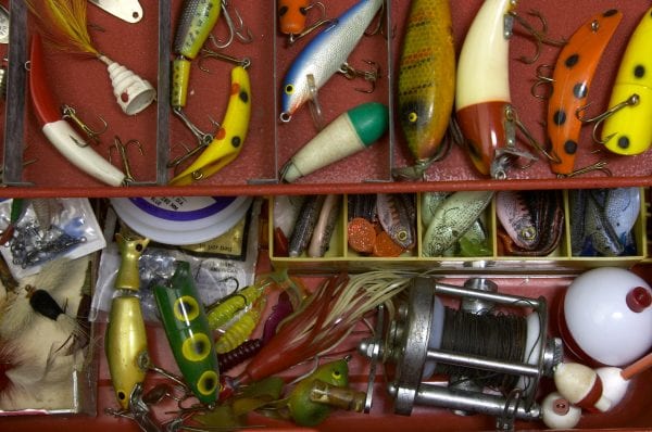 tackle box full of lures, bobbers and more