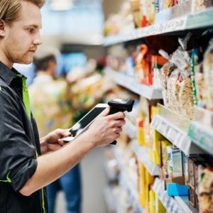 Supermarket Employee Scanning Food Items