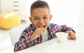 African American boy eating breakfast