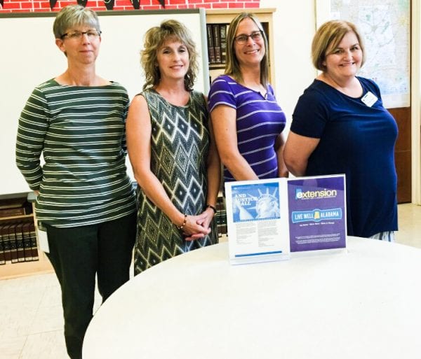 Conecuh and Covington County SNAP-Ed educator, Debbie Beverly poses for a photo with teachers from Conecuh County Junior High School. 