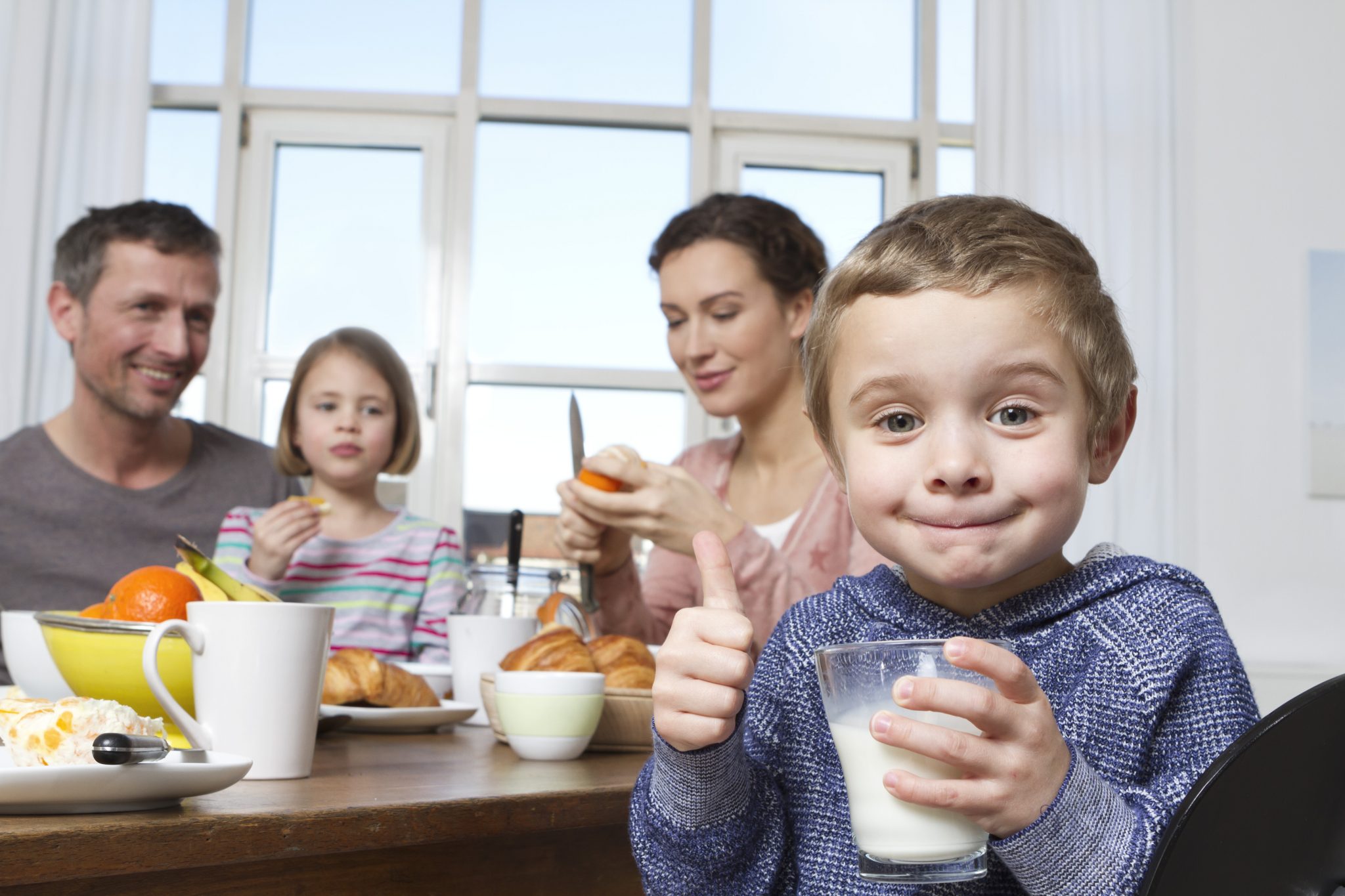 Family of four having healthy breakfast