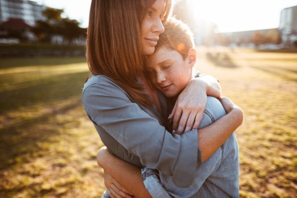 Teenage son with his mom