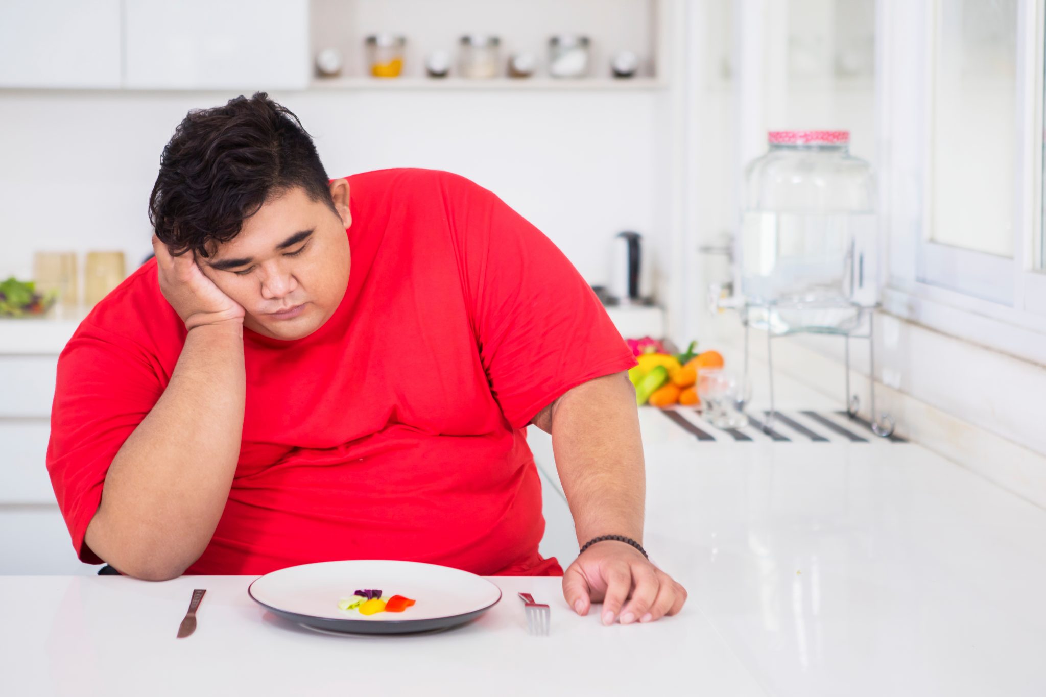 Stressed overweight young man