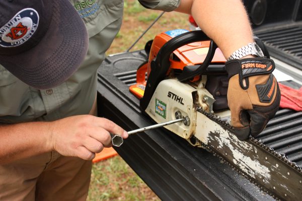 Figure 11. Gloves should be worn when performing saw maintenance.