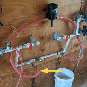 Figure 6. For this demonstration, the flow rate that is being evaluated is going into the medicator through a ball valve emphasized with the yellow arrow.