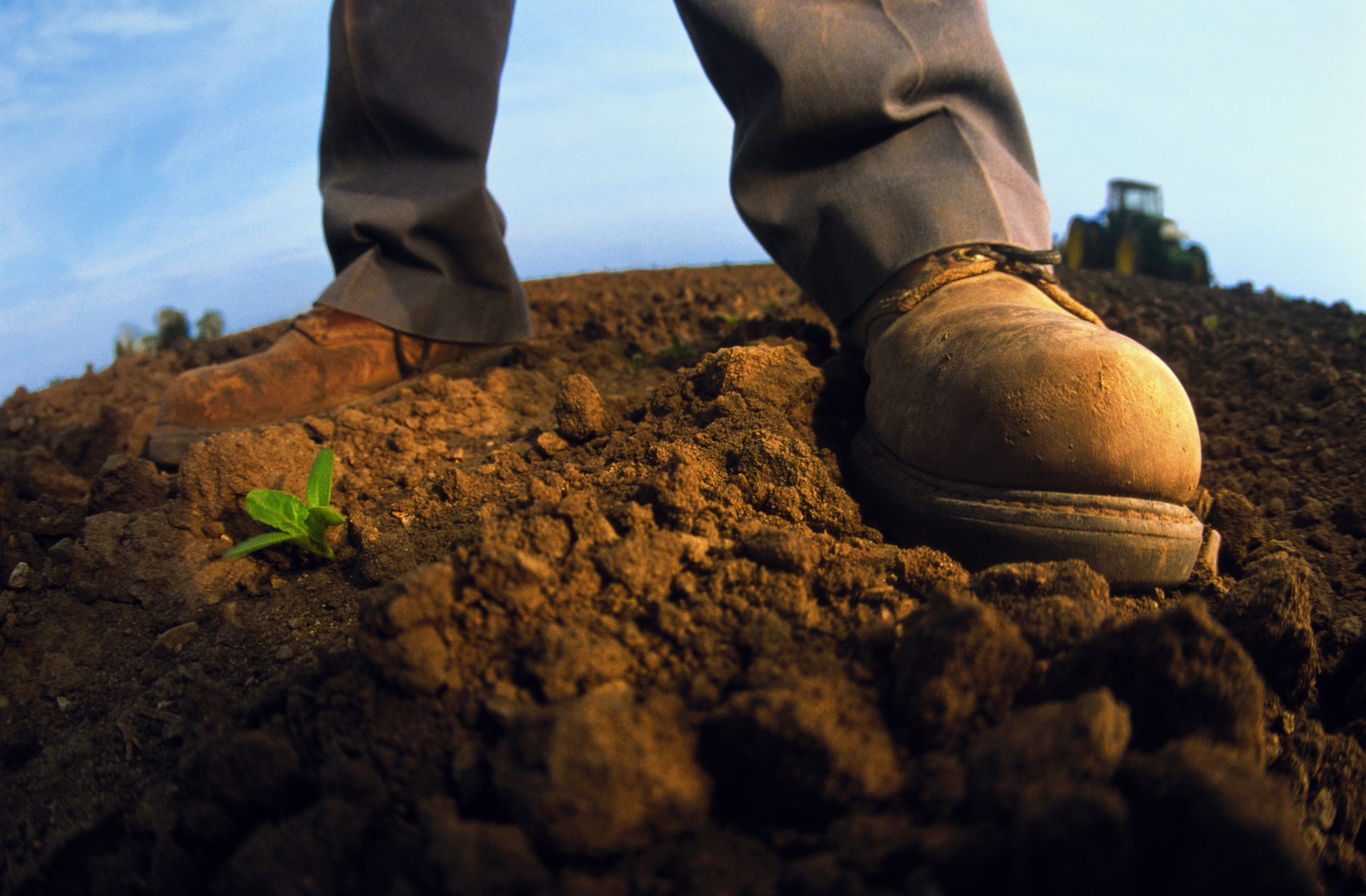 Farmers boots in the soil