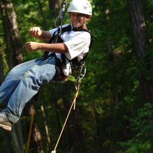 A youth using the zip line at the 4-H Center