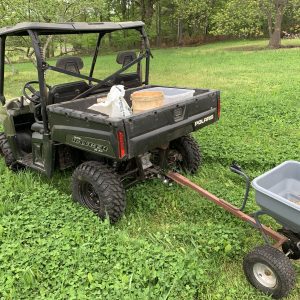 Figure 4b. Both seed and fertilizer can be broadcast using a garden spreader or one mounted to or pulled by an ATV. A hand-operated spreader is used to broadcast seed only.