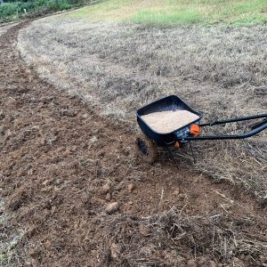 Figure 4c. Both seed and fertilizer can be broadcast using a garden spreader or one mounted to or pulled by an ATV. A hand-operated spreader is used to broadcast seed only.