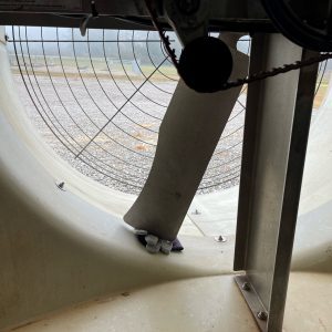 Figure 2. If you remove the fan belt, make sure to chock the fan with something soft like these leather gloves to prevent the fan from spinning against wind pressure or other running fans.