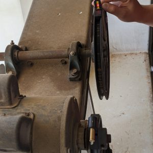 Figure 11. The laser hitting inside the yellow acceptable strip shows that the pulleys are in correct alignment.