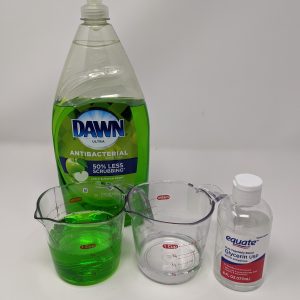Figure 2. Measure 3⁄4 cup liquid dish soap (left) in a measuring cup for each gallon of water. You can also add 1⁄4 cup glycerin (right) per gallon of water to improve bubble stability