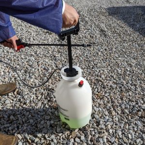Figure 3. Once the solution has been mixed, pump the sprayer handle to create pressure.